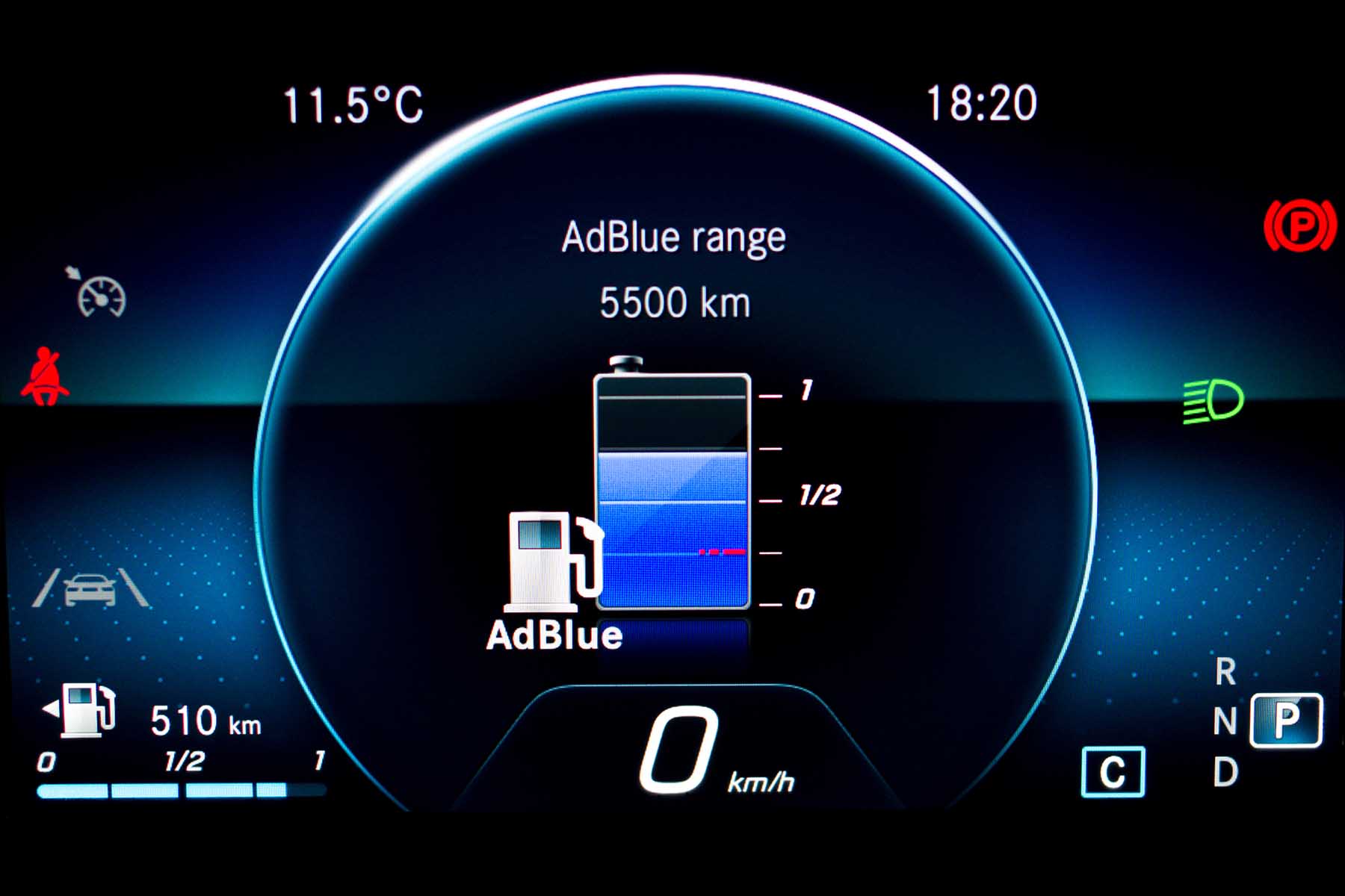 Close up of AdBlue level indicator on illuminated car dashboard